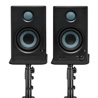 Active nearfield studio monitors placed on acoustic isolation pads